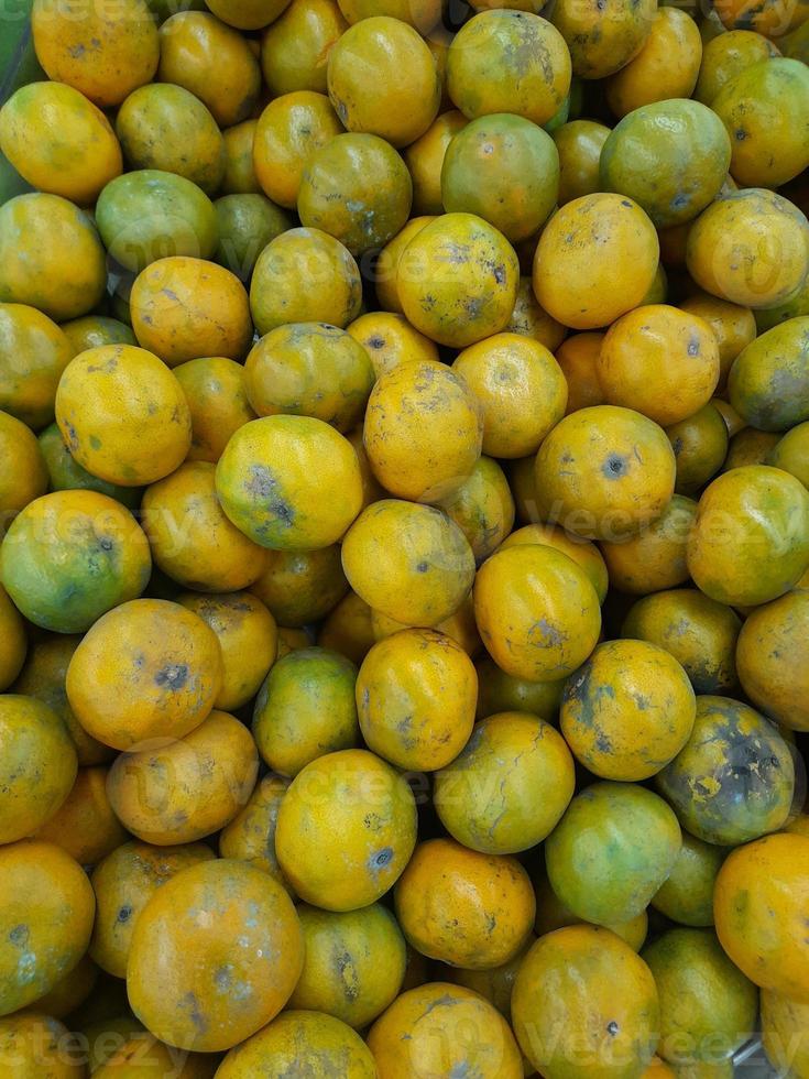 fresh oranges collected and put in one place for sale photo