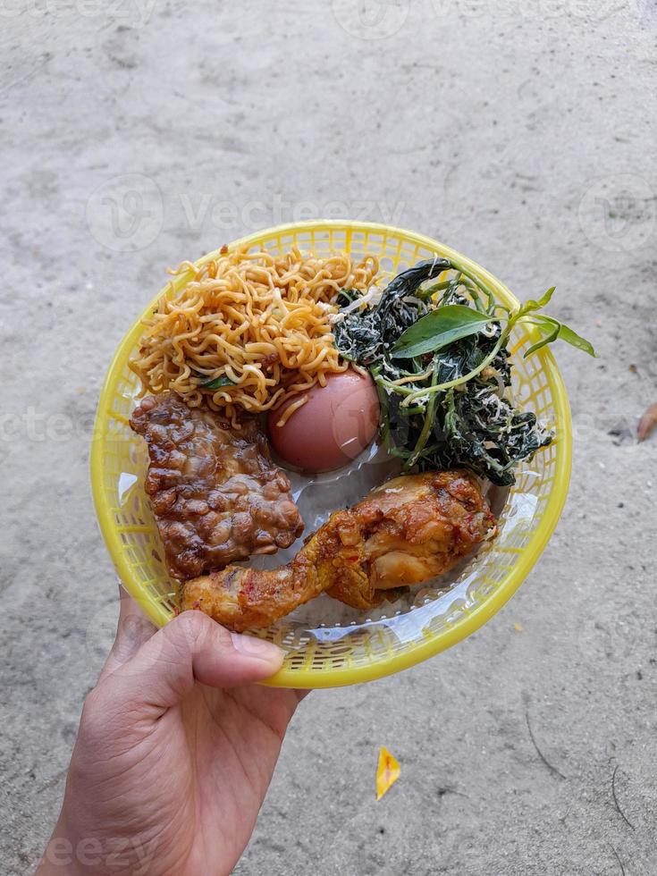 a group of food in one place consisting of seasoned chicken, noodles, eggs, tempeh and green vegetables photo