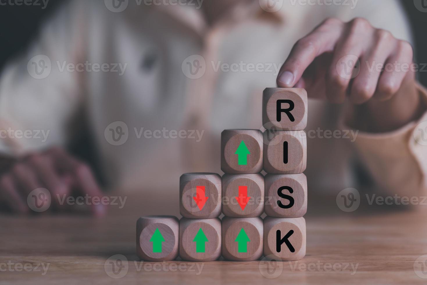 Human hand pointing wooden block and red green arrow icon,Financial risk management and strategic planning through data analysis for continuous improvement Visionary Decisions for Leadership Success photo