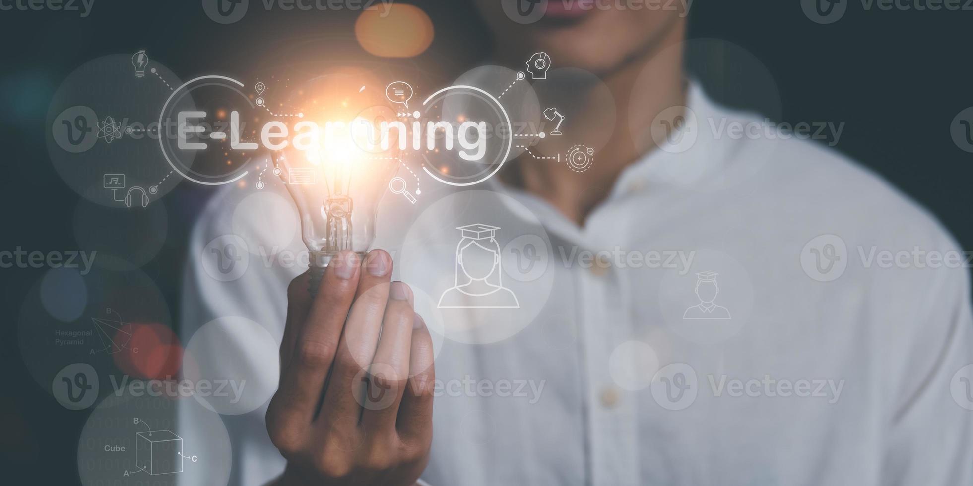 man holding a light bulb, lessons and Internet online education and learning concept, professional courses, learning new things, e-learning webinars, skill enhancement to develop a new career photo