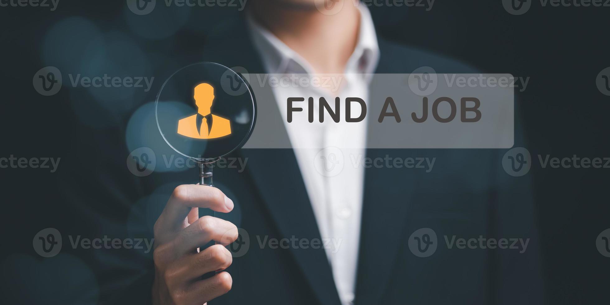 career search ideas, recruitment, HR search, form websites and job applications, businessman holding a magnifying glass and showing an online job search icon ,recruiting the right personnel photo