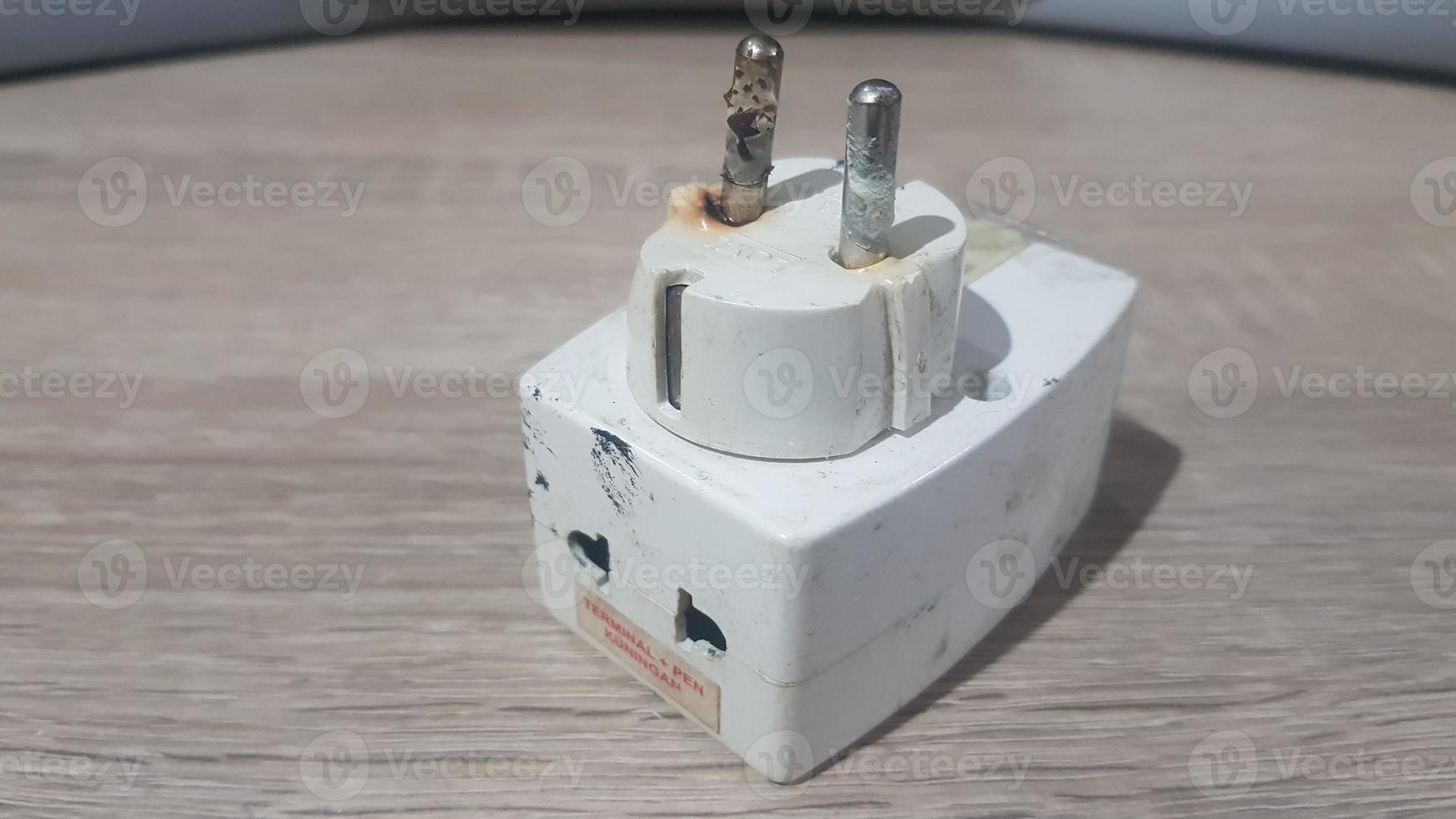 Burnout electrical appliances or electrical plug or electrical adapter dangerous photo