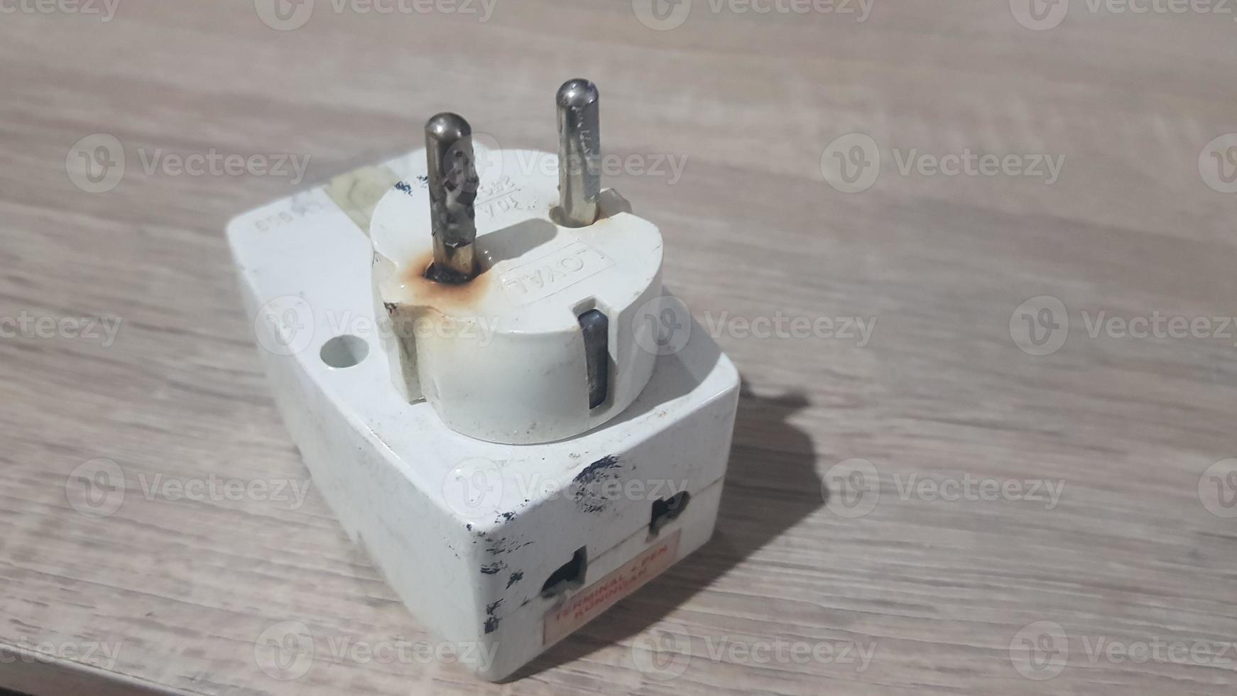 Burnout electrical appliances or electrical plug or electrical adapter dangerous photo