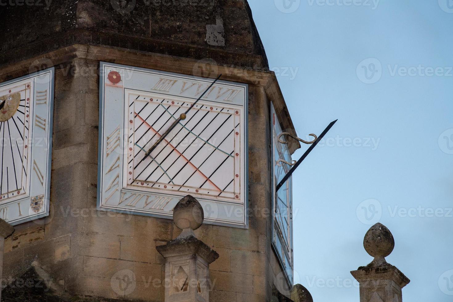 trinity college cambridge sundial at sunset photo