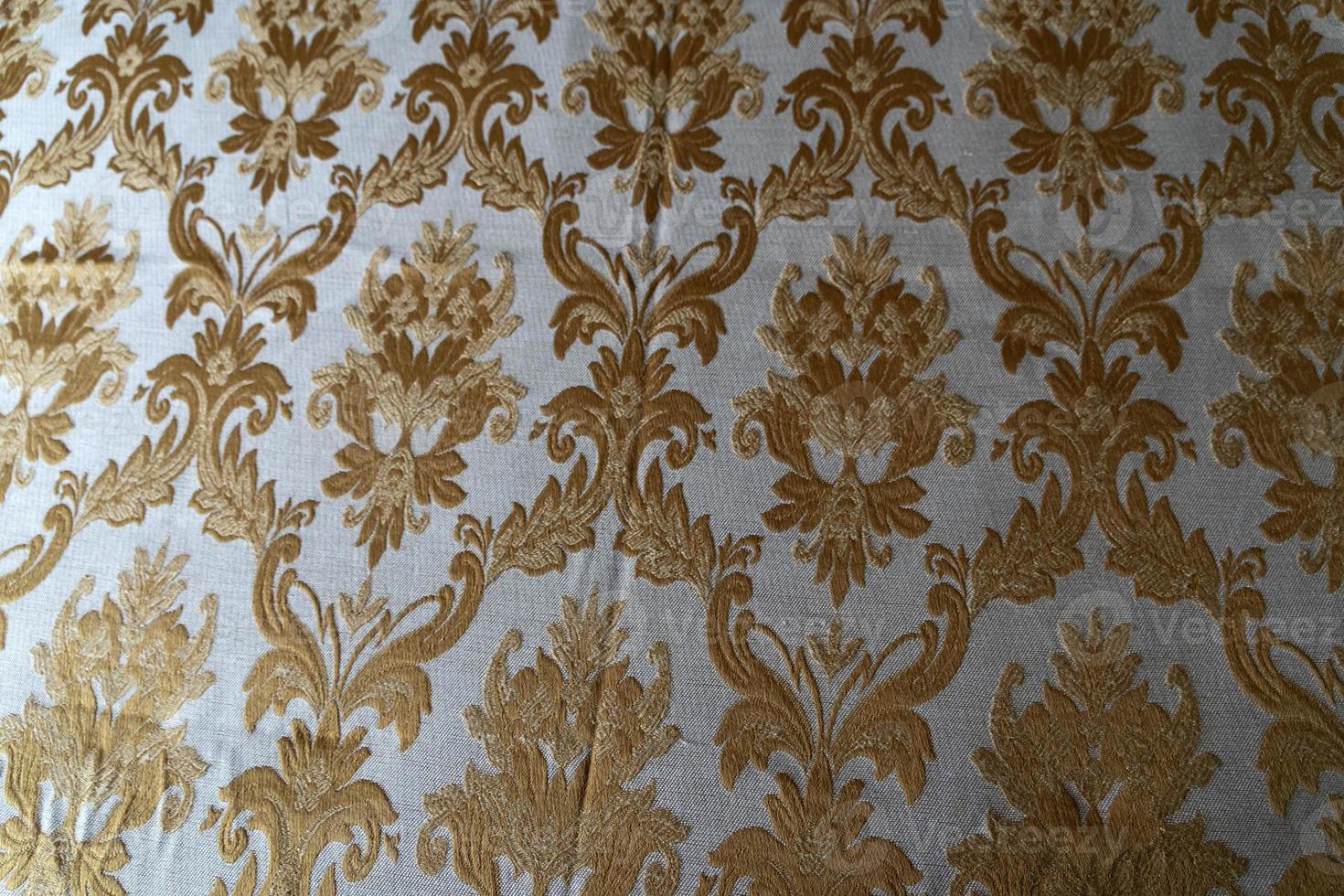 medieval fabric texture background gold and white photo