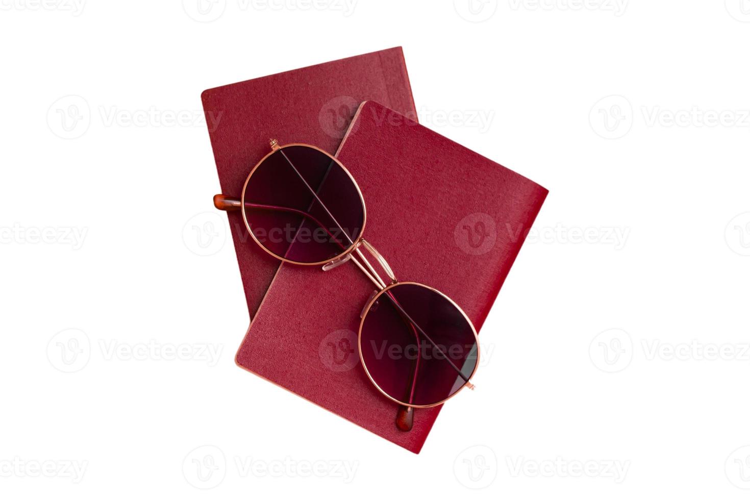 3732 Red notebooks and sunglasses isolated on a transparent background photo