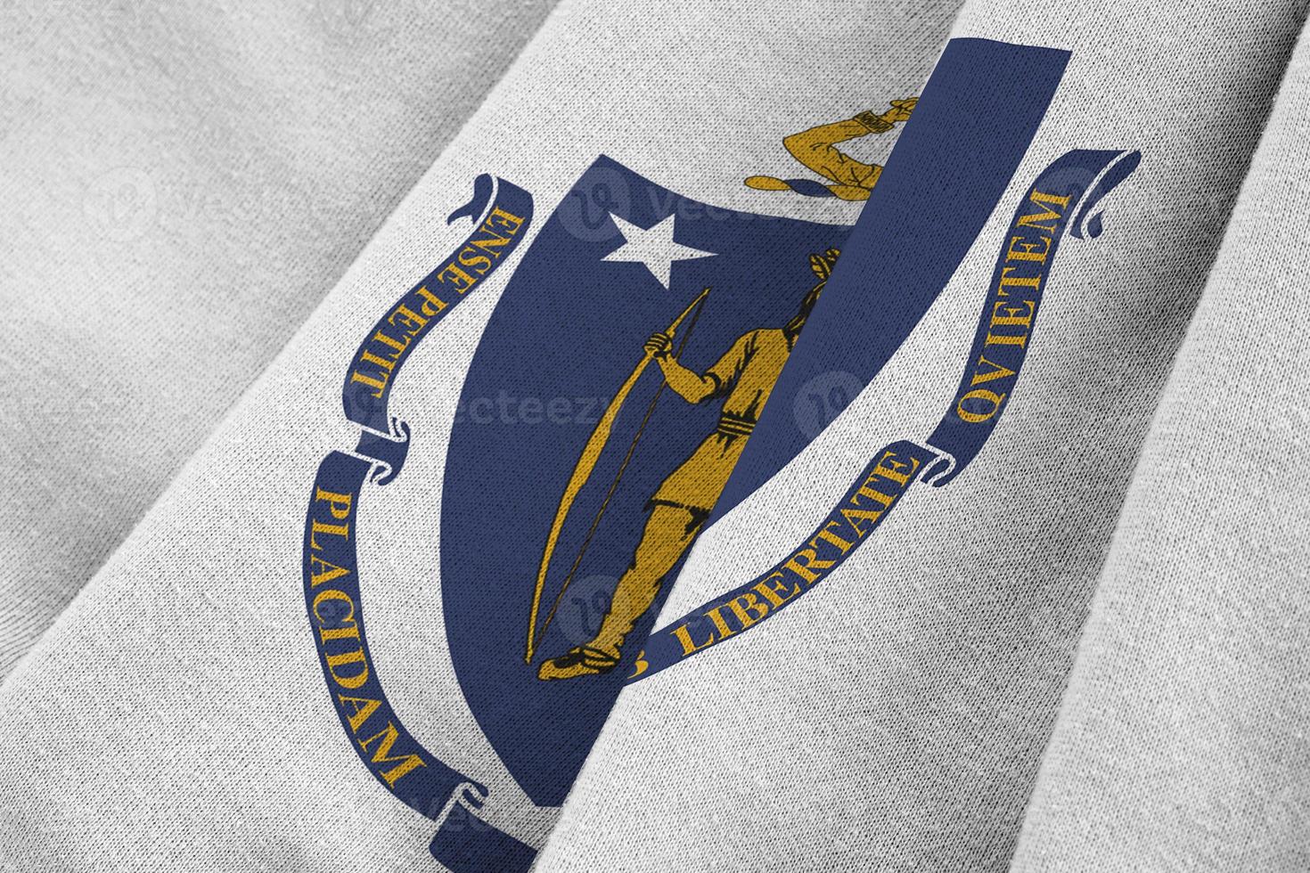 Massachusetts US state flag with big folds waving close up under the studio light indoors. The official symbols and colors in banner photo