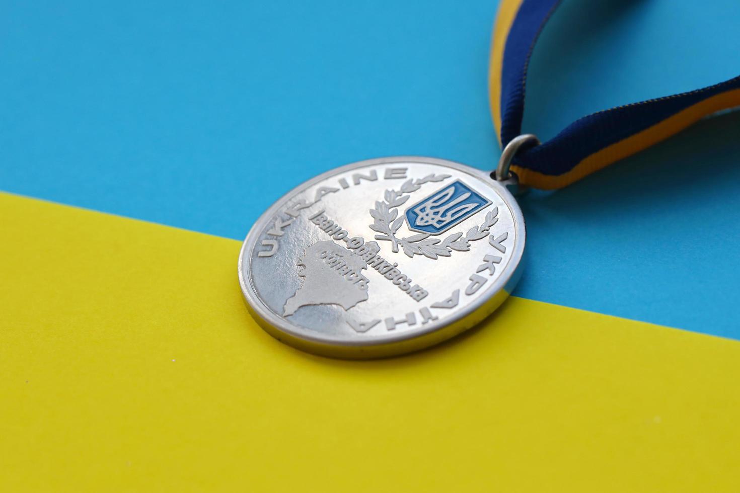 KYIV, UKRAINE - MAY 4, 2022 Medal for the person who conquered Mount Hoverla photo