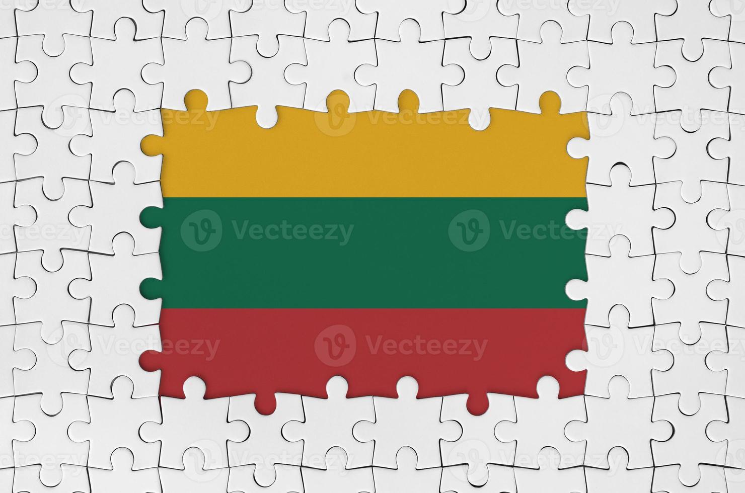 Lithuania flag in frame of white puzzle pieces with missing central part photo