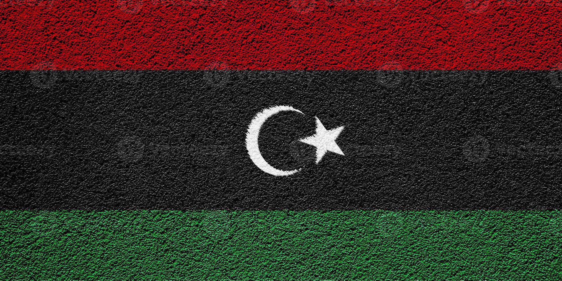 Flag of Libya on a textured background. Concept collage. photo