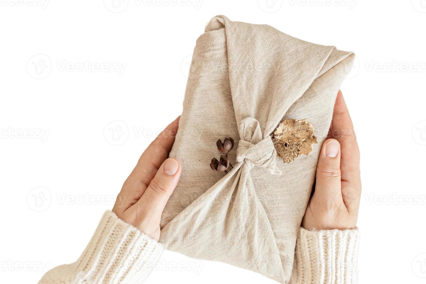 6896 Beige gift box and woman hands isolated on a transparent background photo