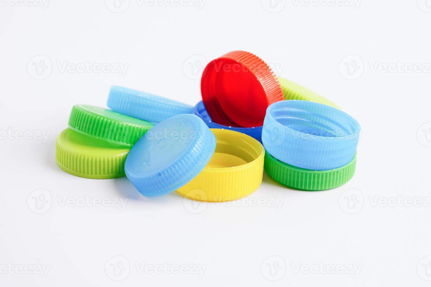 Plastic bottle caps colorful for recycle on white background. photo