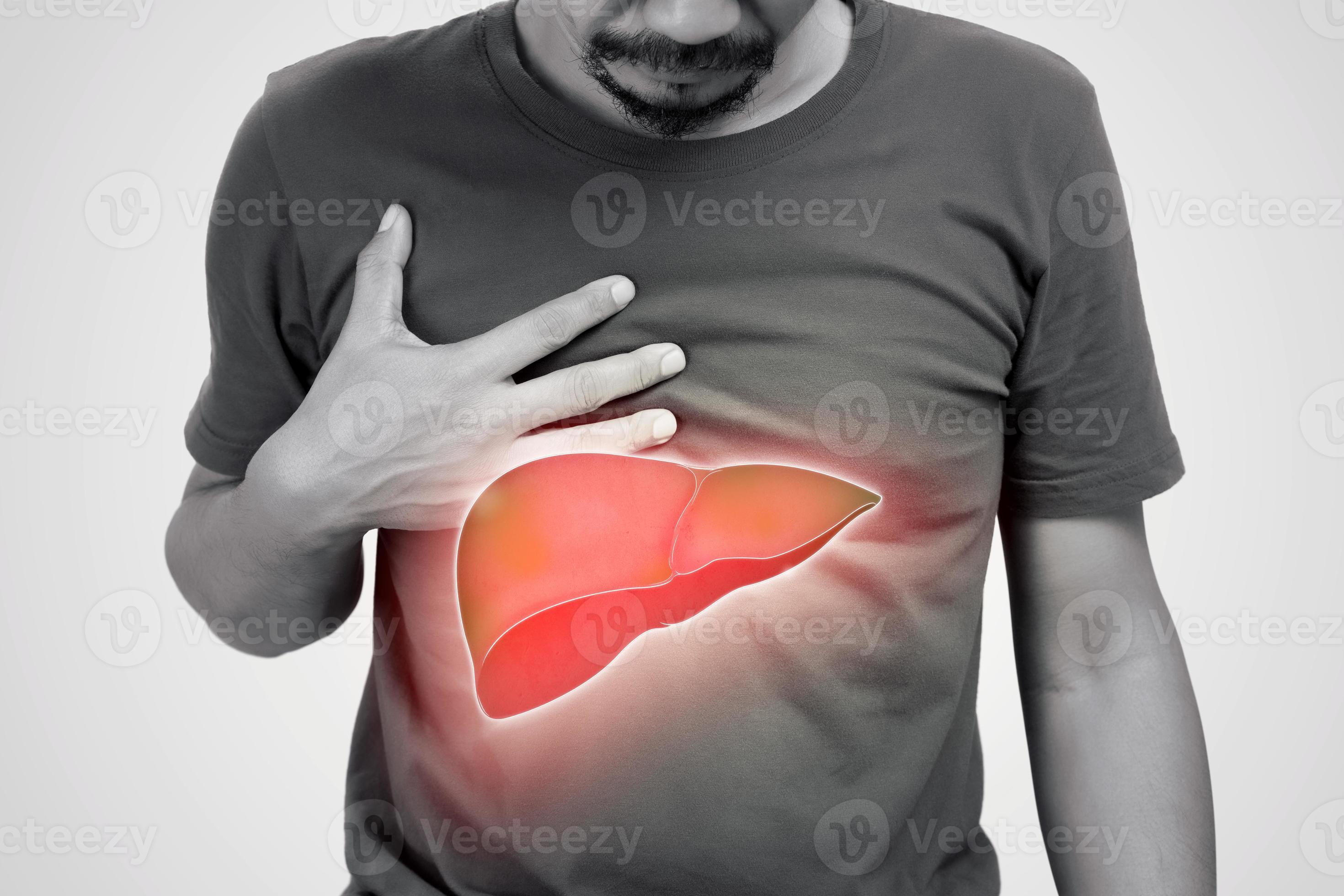 The illustration of liver is on the man's body against gray background. A men with hepatitis and