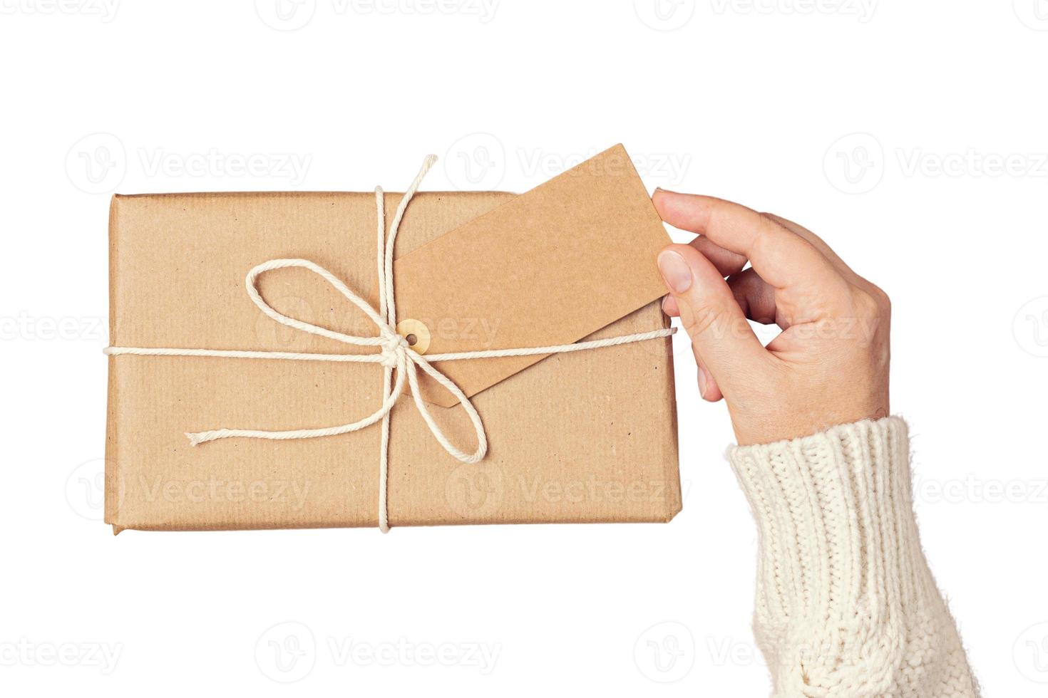 6464 Beige gift box held by a woman's hands isolated on a transparent background photo