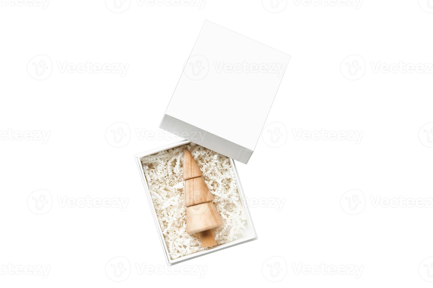 6658 Beige wooden christmas tree on a white box isolated on a transparent background photo