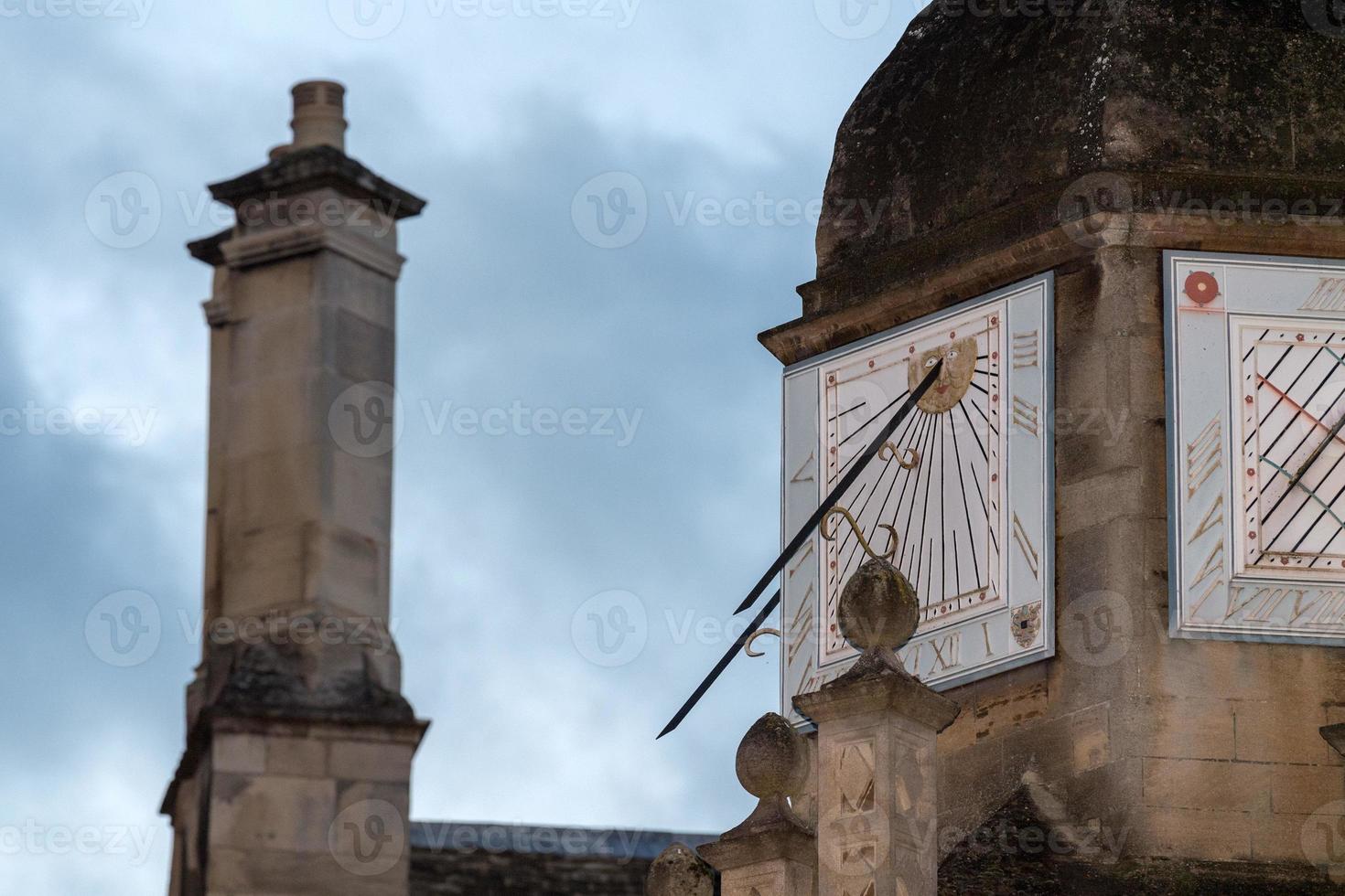 trinity college cambridge sundial at sunset photo