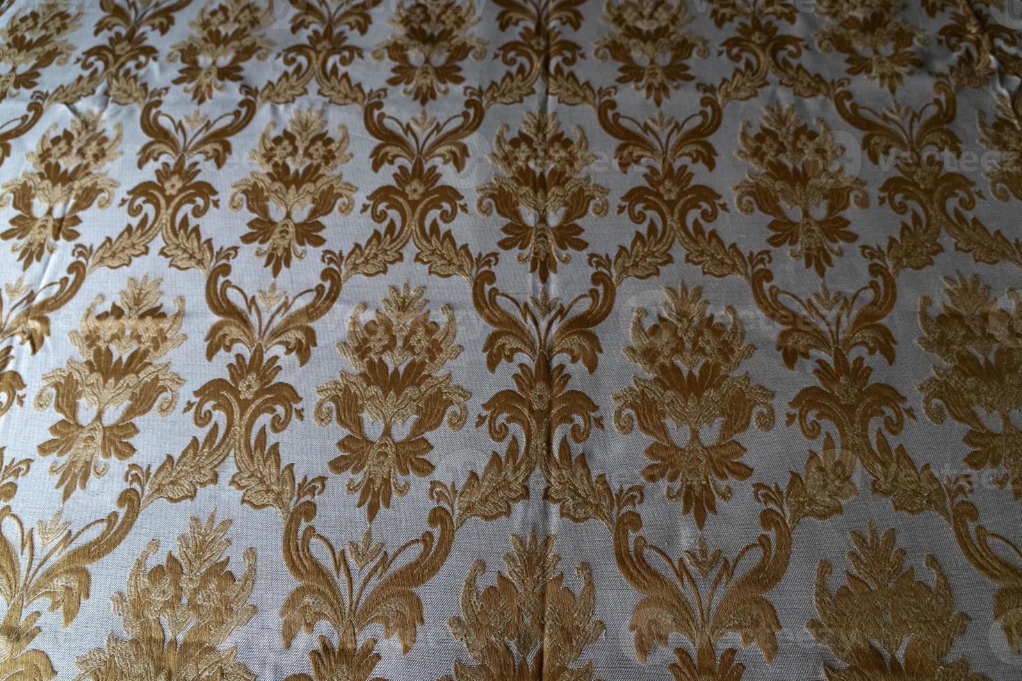 medieval fabric texture background gold and white photo