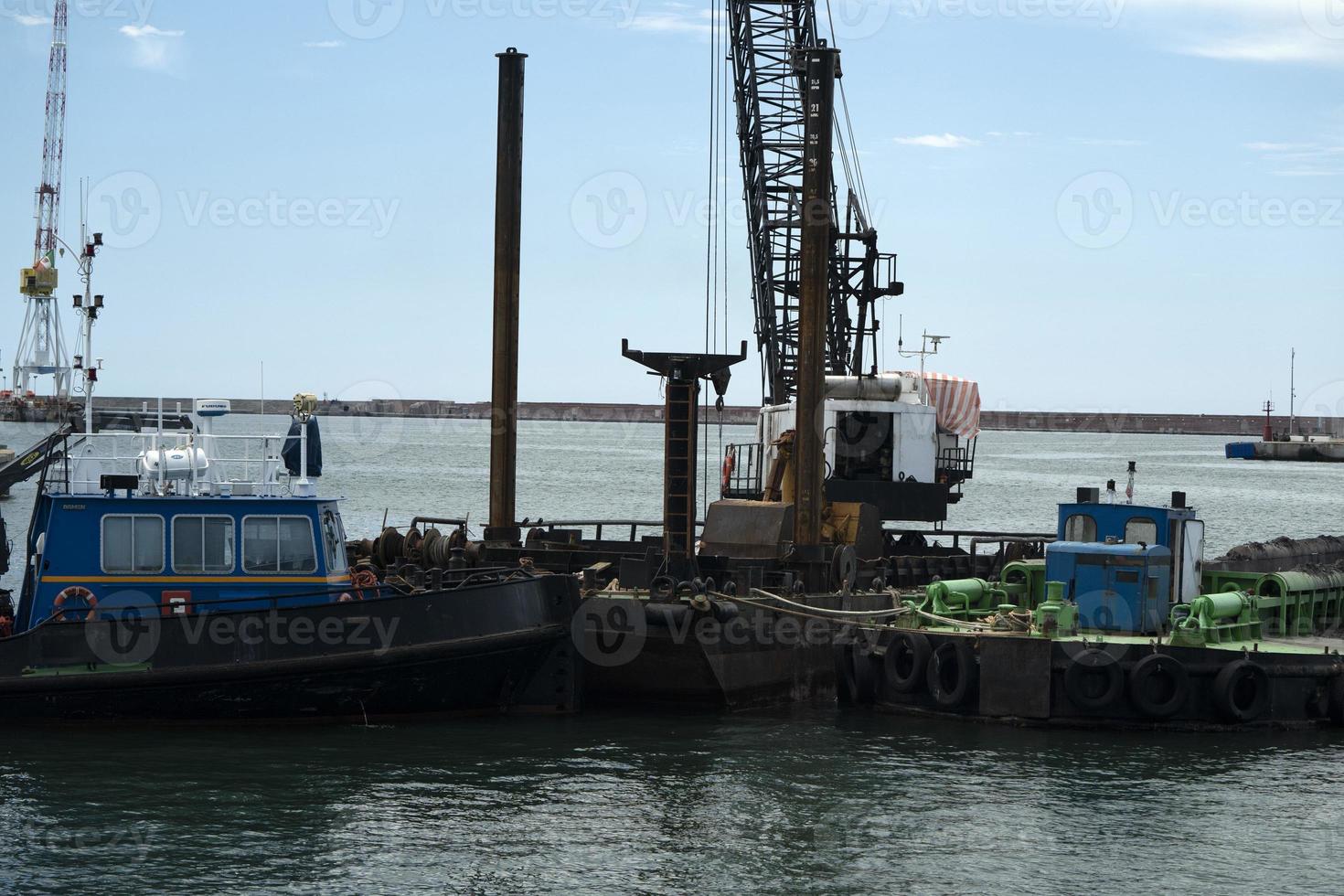 Harbor port dredge working on sea photo