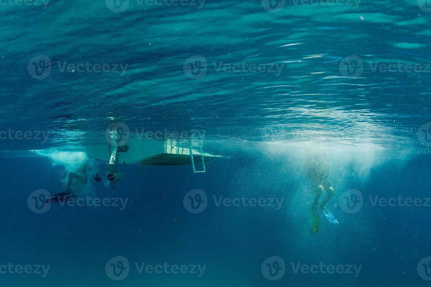 scuba diver jumping from boat photo