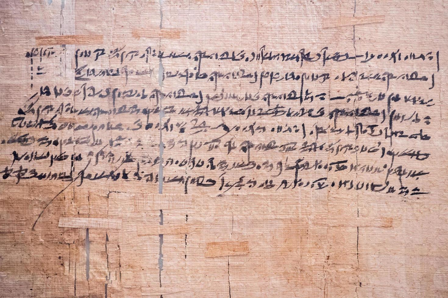 ancient arabic writings on papyrus photo