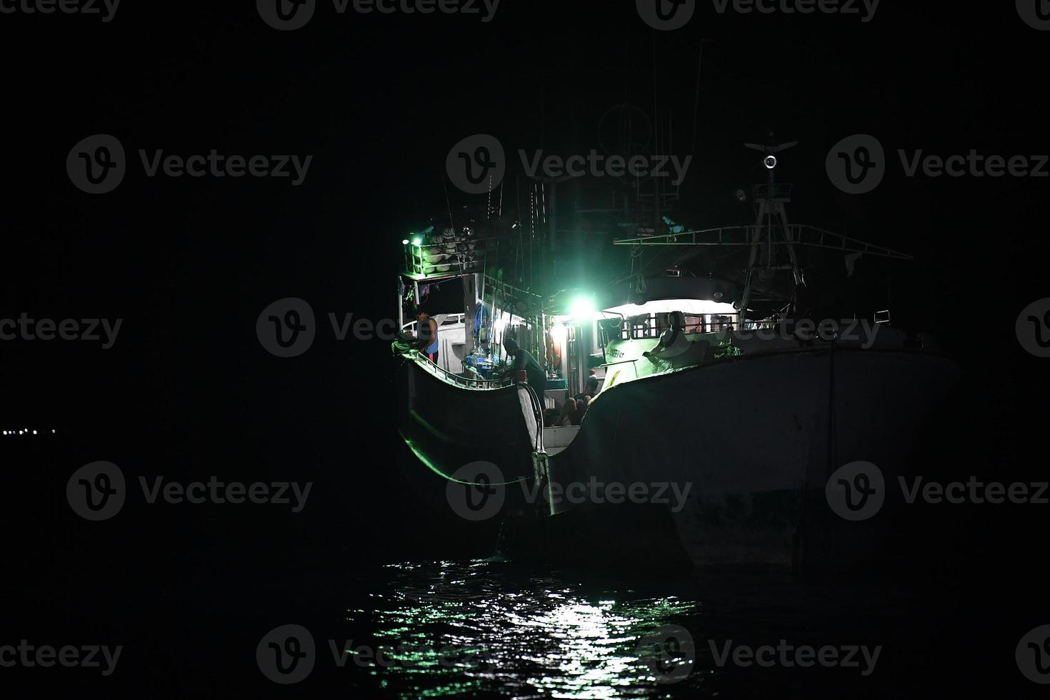 maldivian fishing boat in maldives at night photo