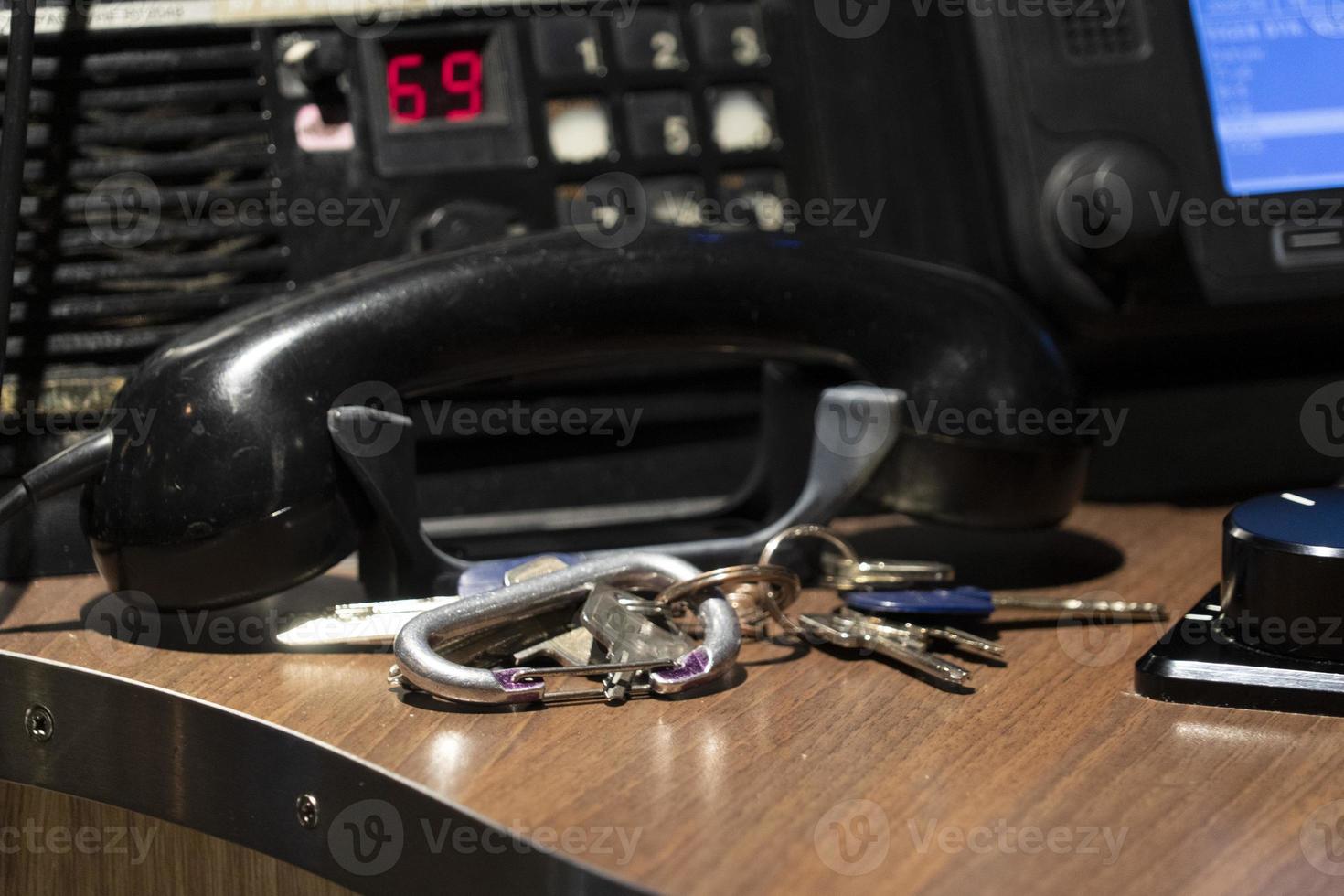 Boat radio telephone and keys on command deck photo