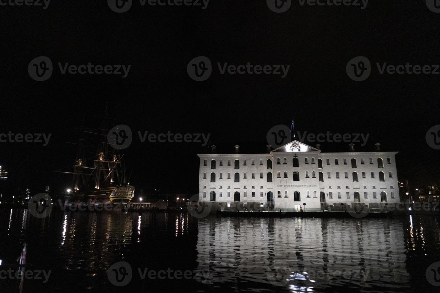 amsterdam canal vessel ship museum at night photo