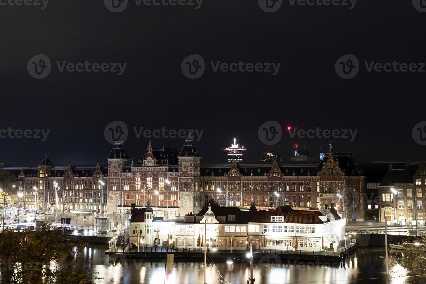 amsterdam central station at night cityscape photo