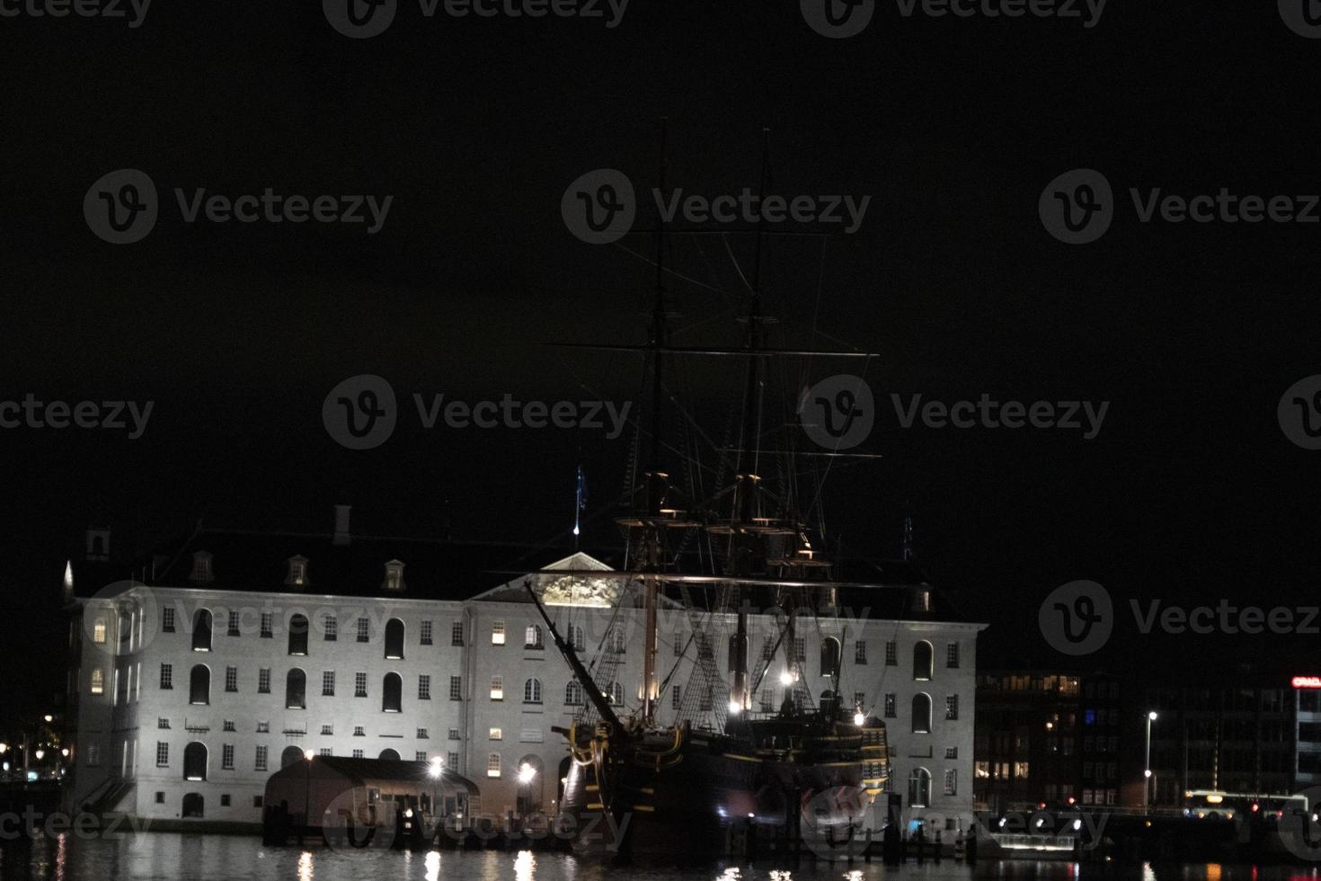 amsterdam canal vessel ship museum at night photo