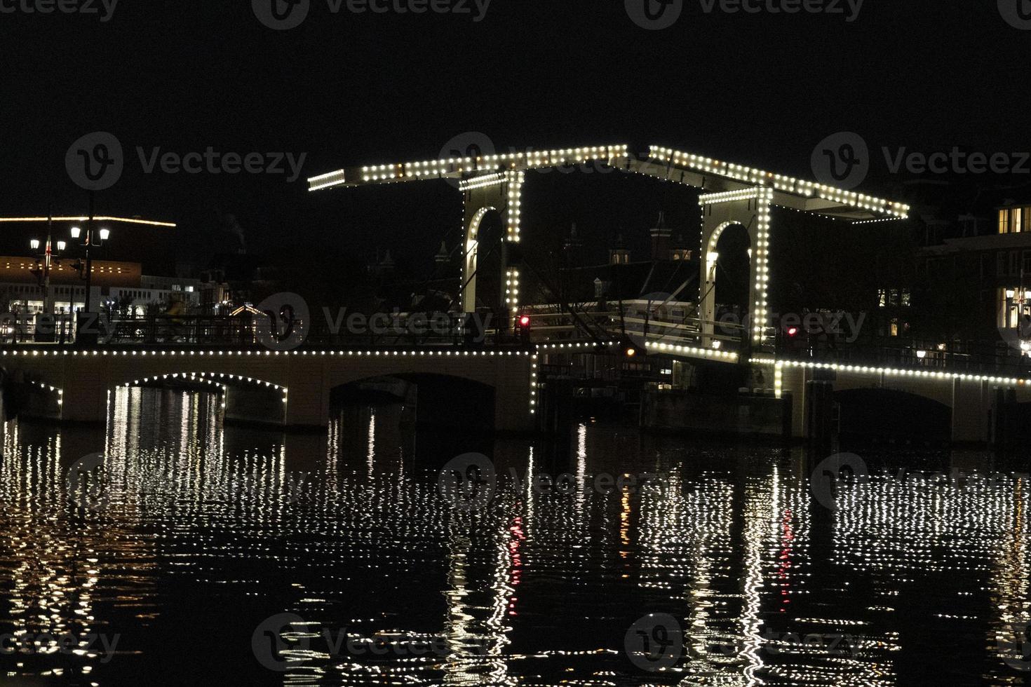 amsterdam canals cruise at night bridge photo