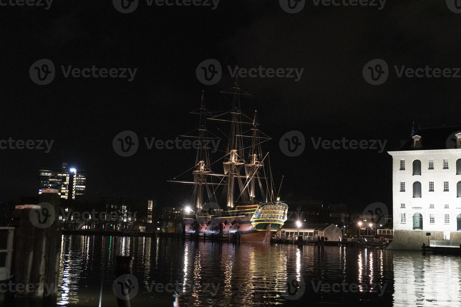 amsterdam canal vessel ship museum at night photo