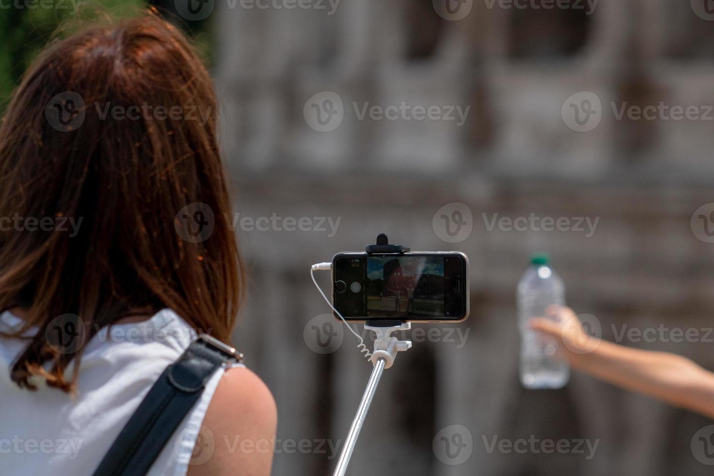 Selfie with smartphone at Trevi Fountain crowded of tourists Rome Italy photo