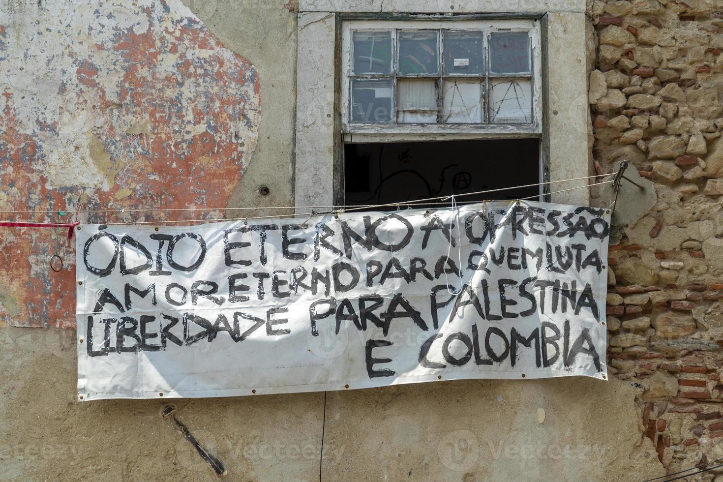 freedom for colombia and palestina banner on lisbon window eternal hate for oppresion and love for who is fighting photo