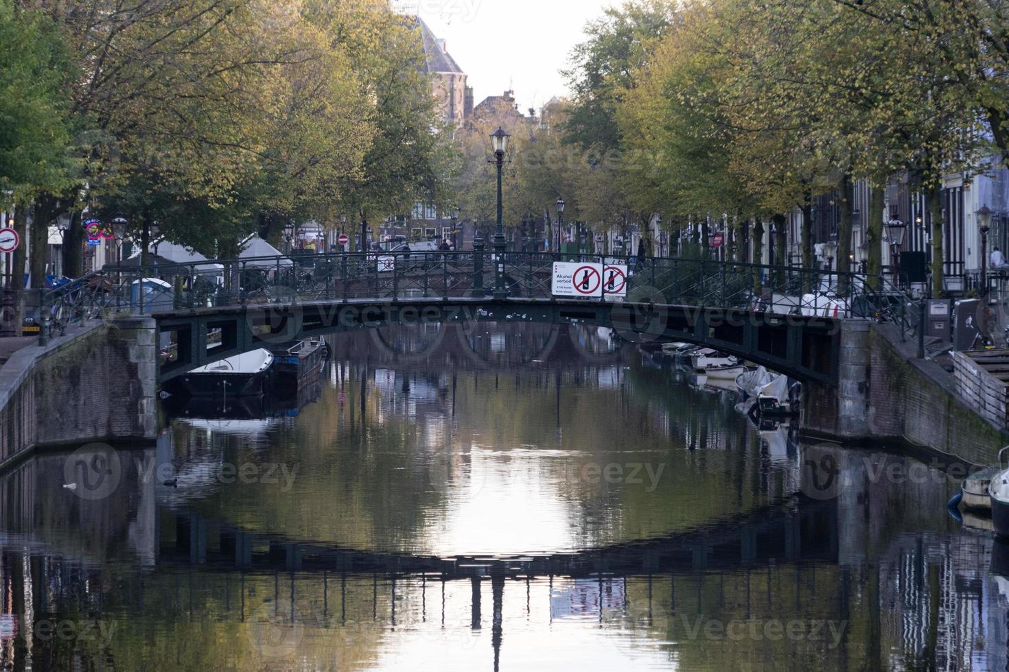 do not drink amsterdam sign in canal photo