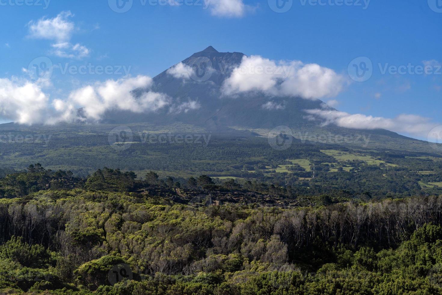 Volcano pico azores mountain in clouds photo