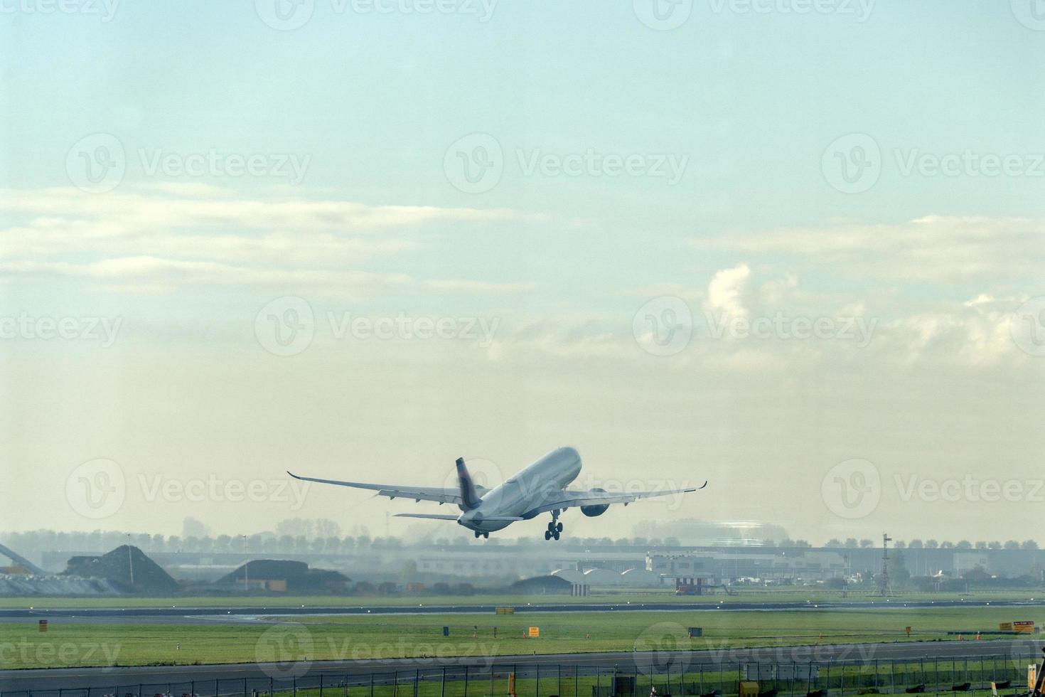 Airplane jet while taking off photo