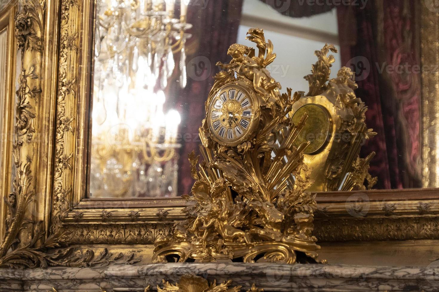 antique gold table clock from france photo