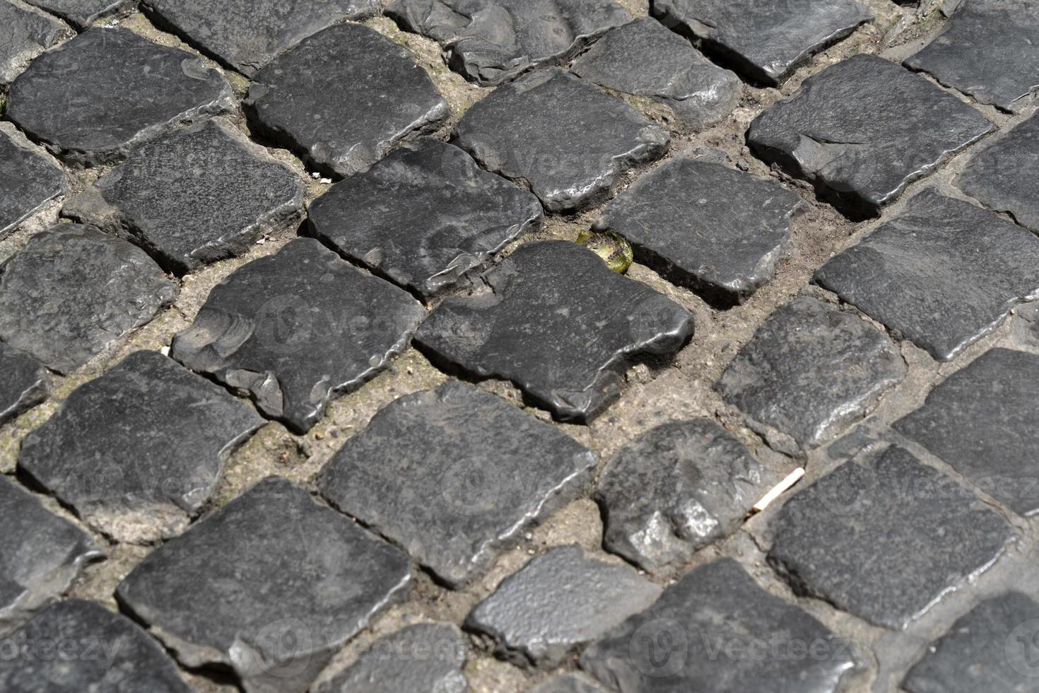 Sampietrini stone pavel road in rome photo