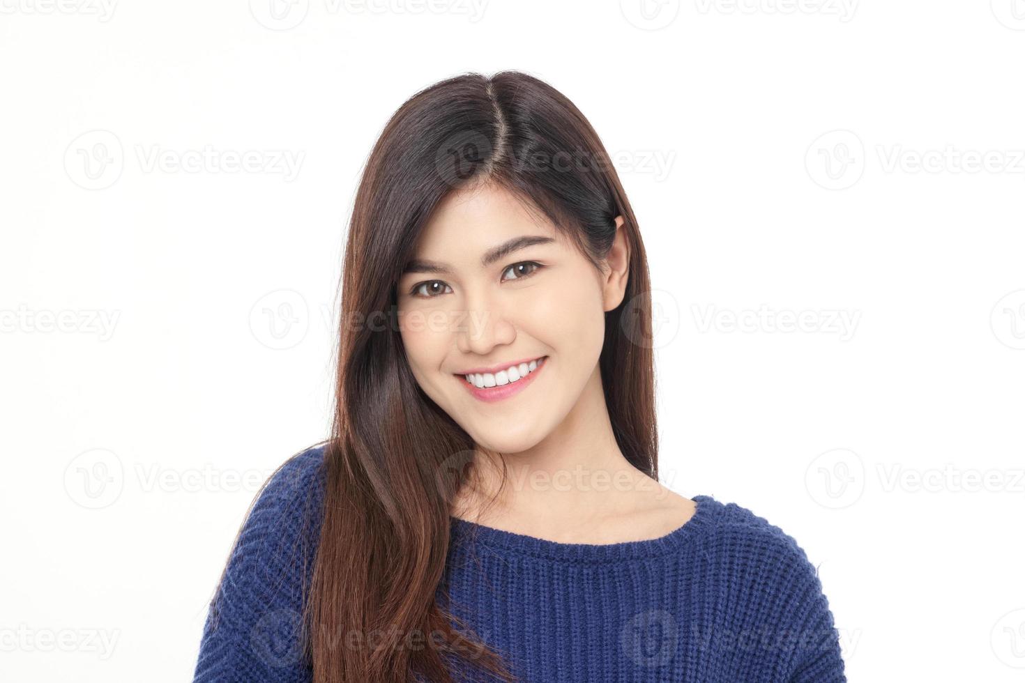 Asian girl Pretty cute smile Clean and white aligned teeth Standing on a white background. Healthy young woman concept. photo