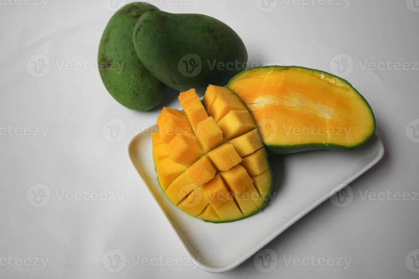 Set of mango cubes and mango slices. photo