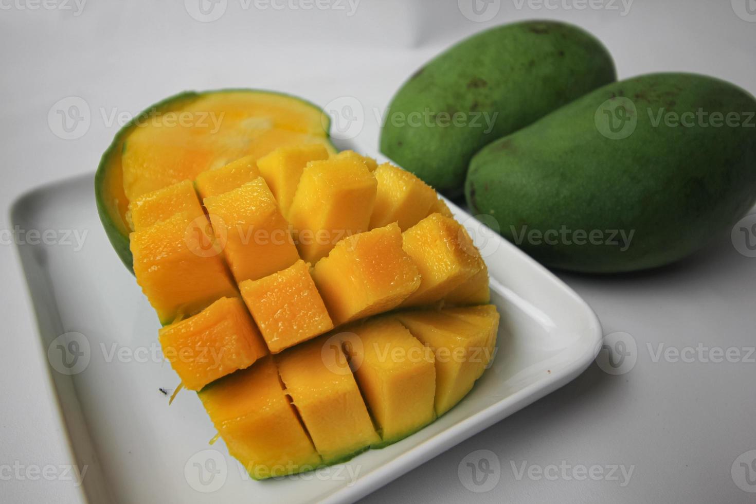 Set of mango cubes and mango slices. photo