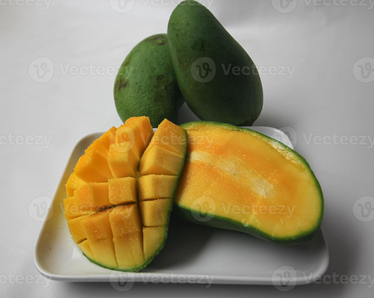 Set of mango cubes and mango slices. photo