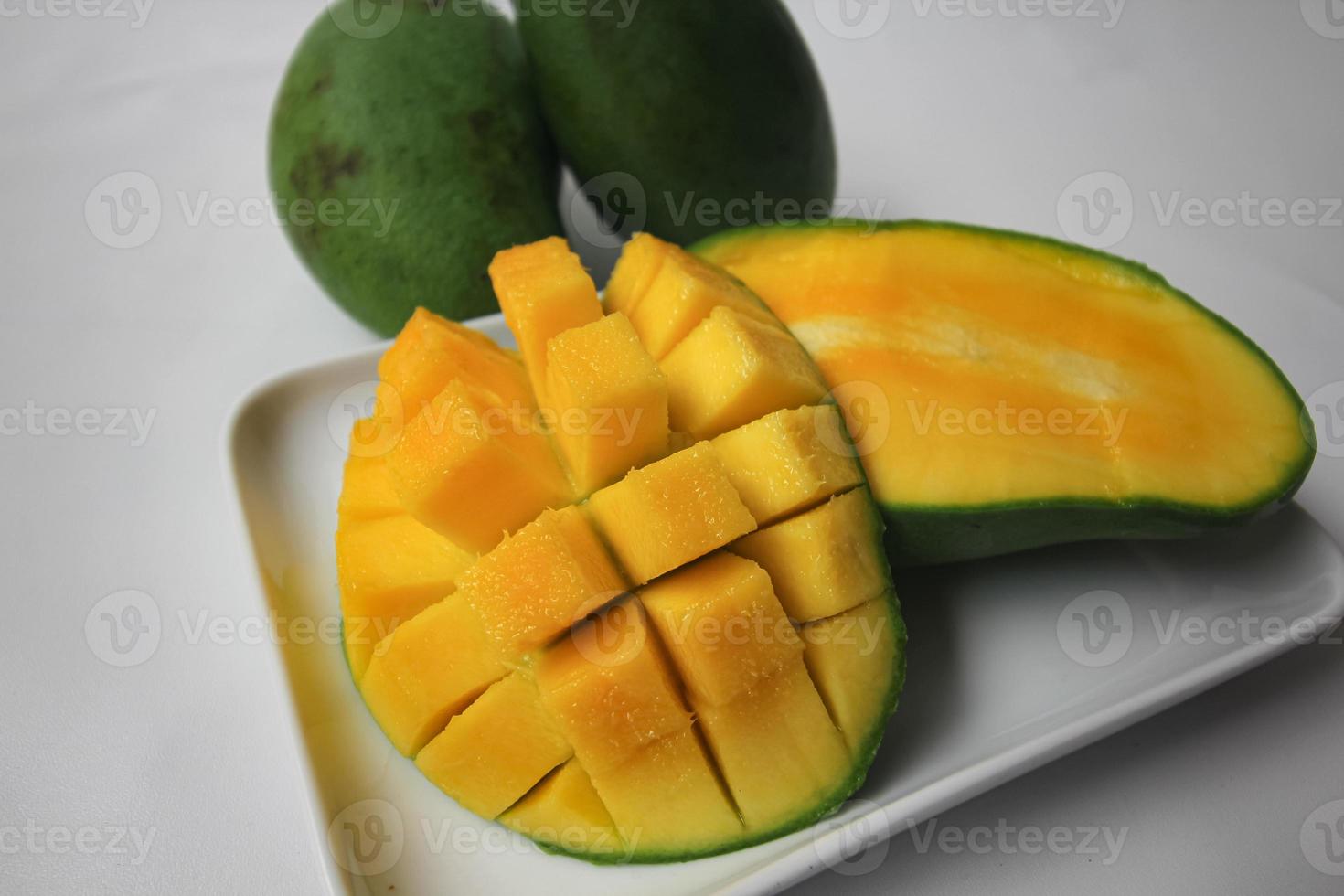 Set of mango cubes and mango slices. photo