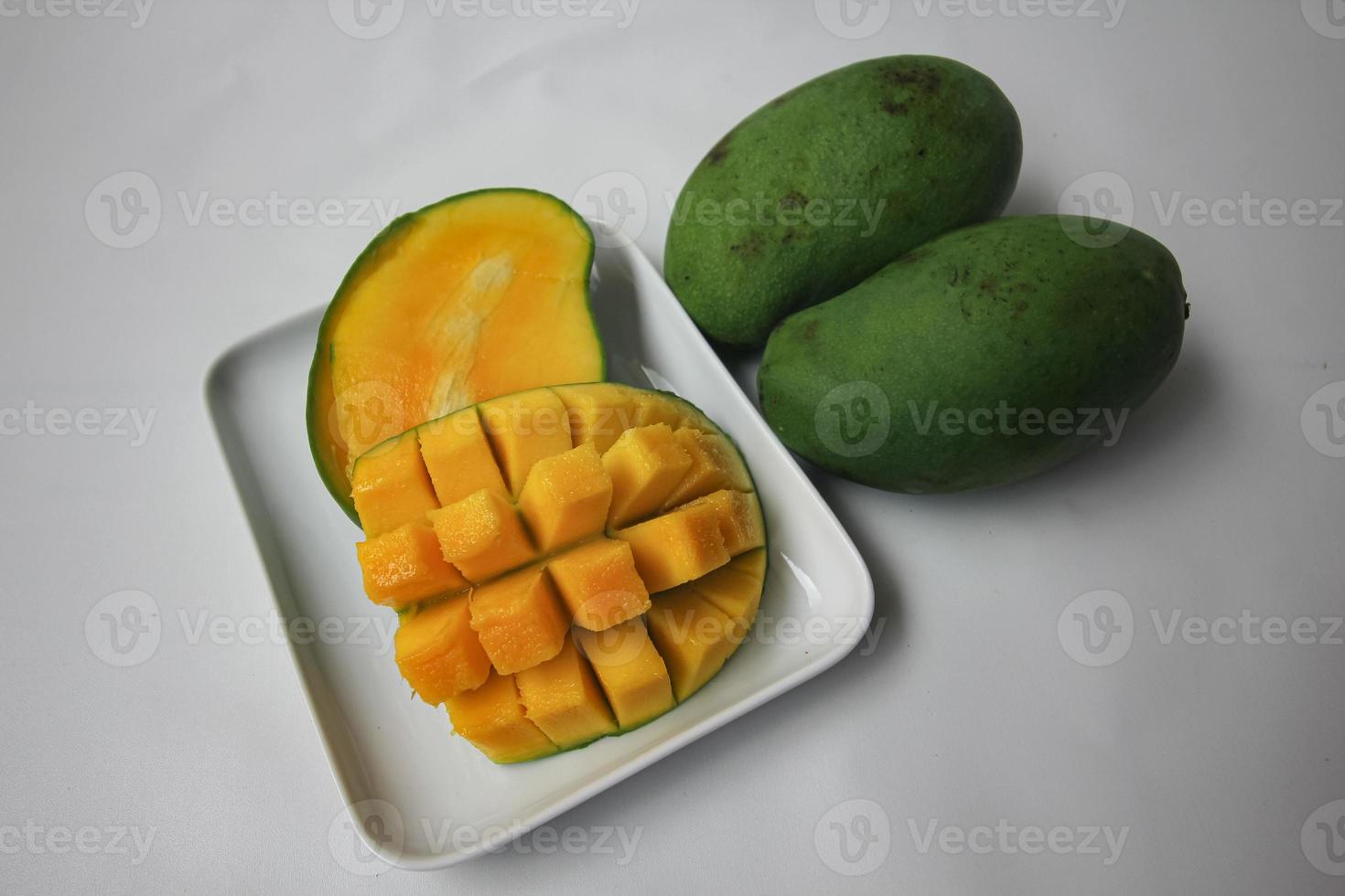Set of mango cubes and mango slices. photo