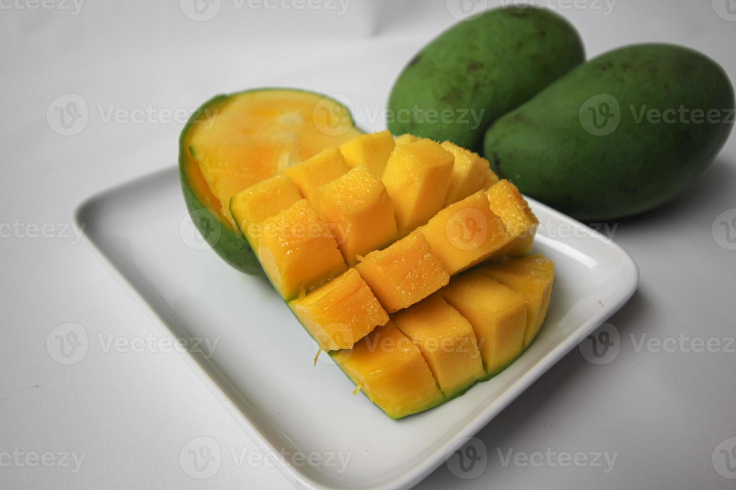 Set of mango cubes and mango slices. photo
