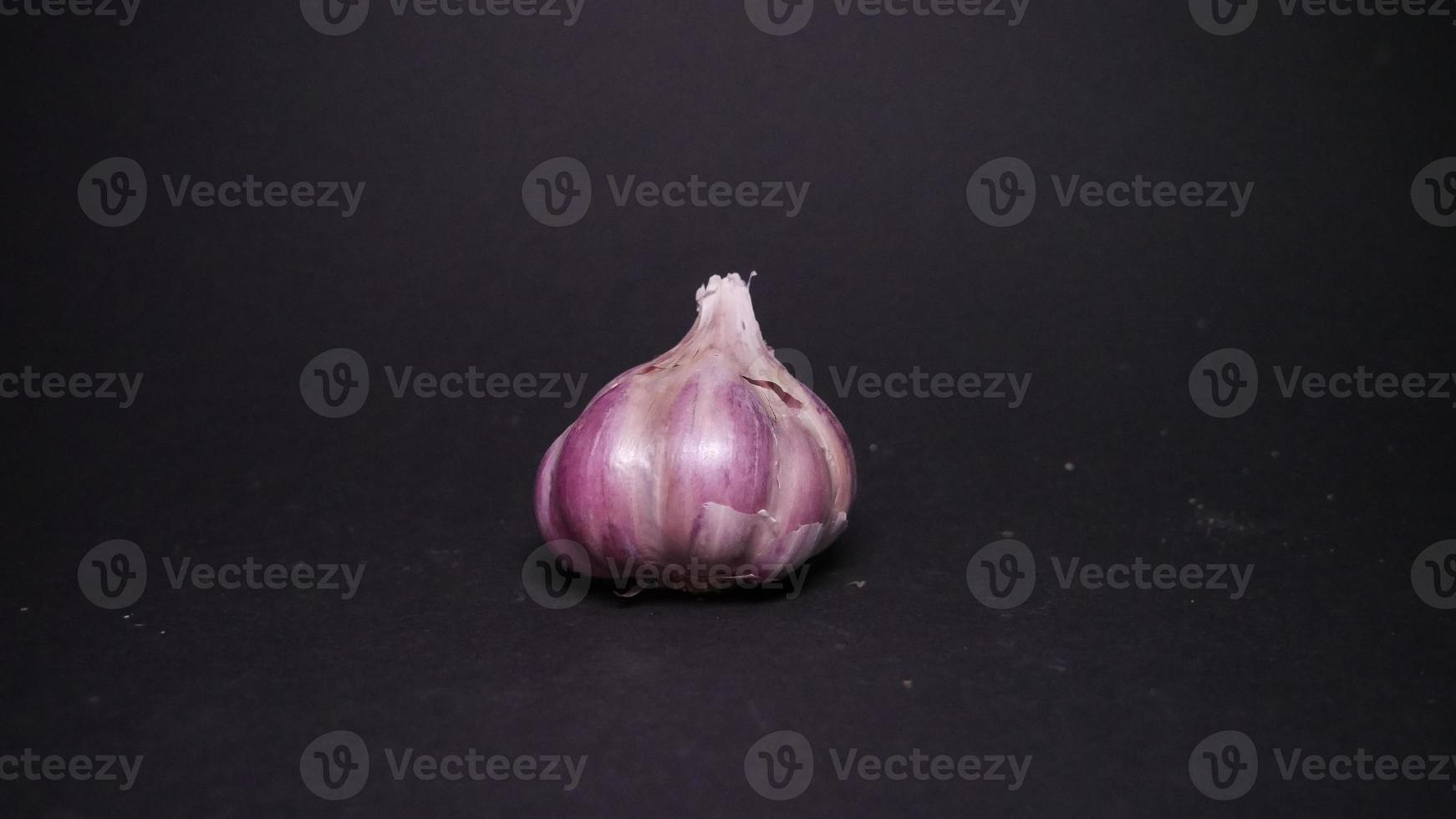 Ripe garlic close-up on a black background photo