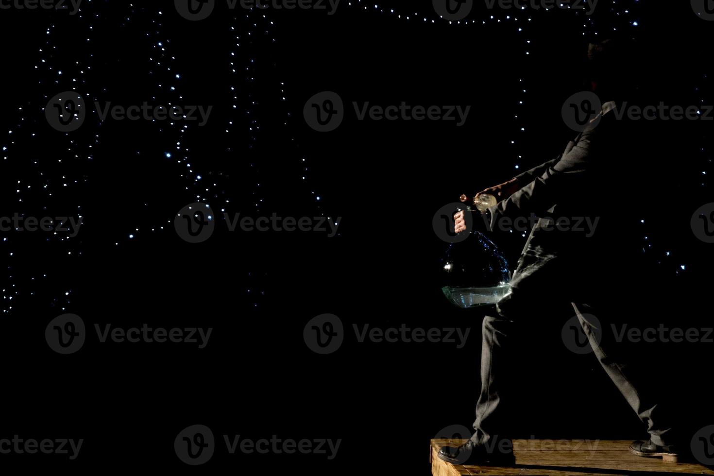 Man mixing spirits in ampoul photo