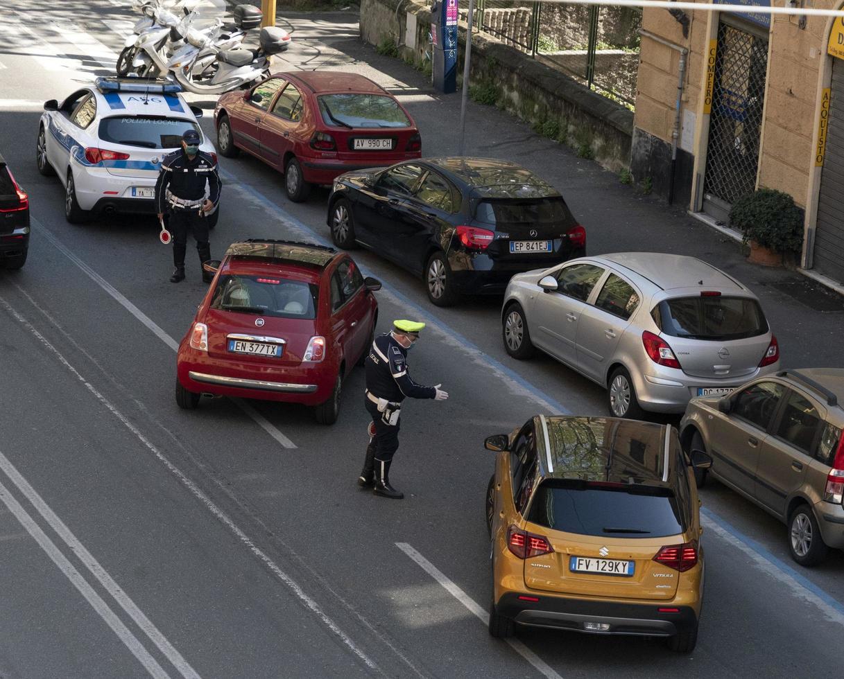 GENOA, ITALY - APRIL 9 2020 - Local police control during coronavirus covid quarentine photo