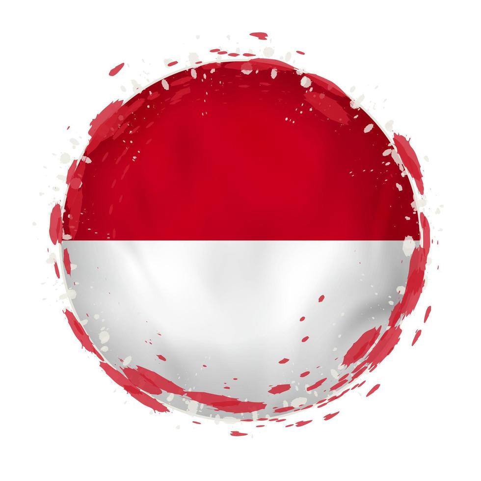 Round grunge flag of Monaco with splashes in flag color. vector