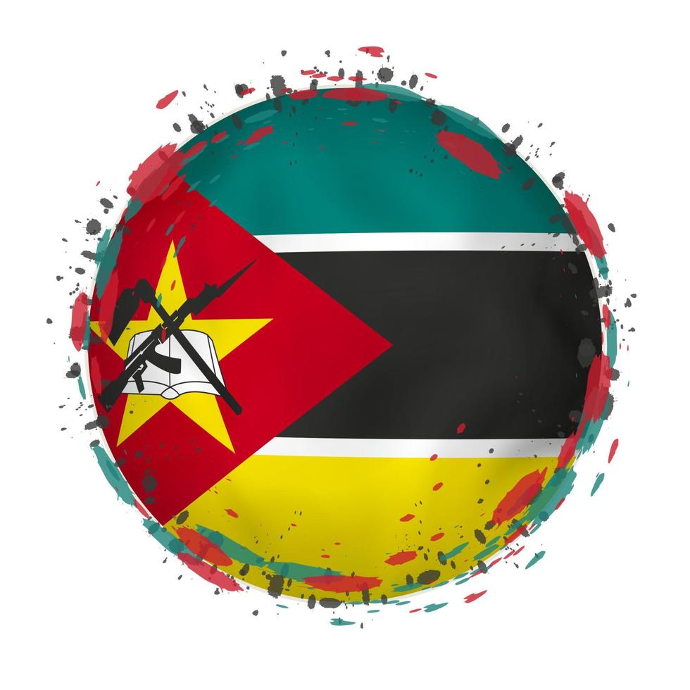 Round grunge flag of Mozambique with splashes in flag color. vector